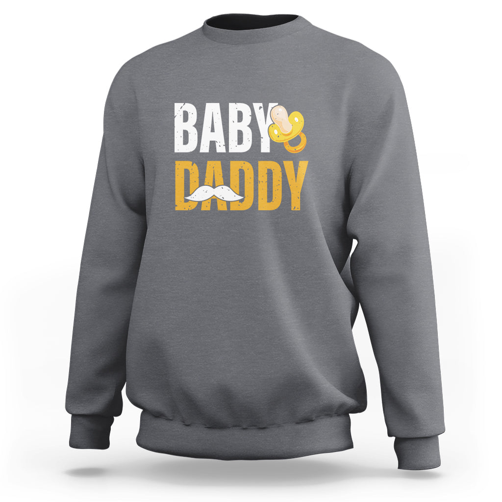Gray crewneck sweatshirt with 'BABY DADDY' text and baby icon graphic