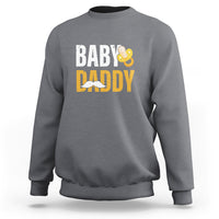 Gray crewneck sweatshirt with 'BABY DADDY' text and baby icon graphic