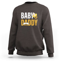 Charcoal crewneck sweatshirt with 'BABY DADDY' text and baby icon graphic