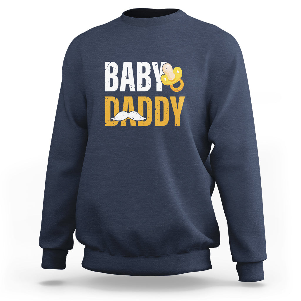 Navy crewneck sweatshirt with 'BABY DADDY' text and baby icon graphic