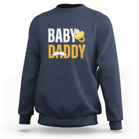 Navy crewneck sweatshirt with 'BABY DADDY' text and baby icon graphic