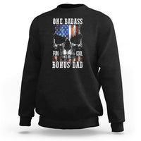 Black crewneck sweatshirt with “One Badass Bonus Dad” skull graphic on back