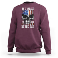 Maroon crewneck sweatshirt with “One Badass Bonus Dad” skull graphic on back