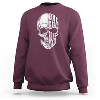 Maroon crewneck sweatshirt with white skull graphic on back