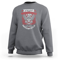 Gray motorcycle graphic sweatshirt with skull eagle emblem and striped 'Never Underestimate'
