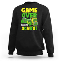 Black crewneck sweatshirt with “GAME OVER” and game-themed “BACK TO SCHOOL” graphic