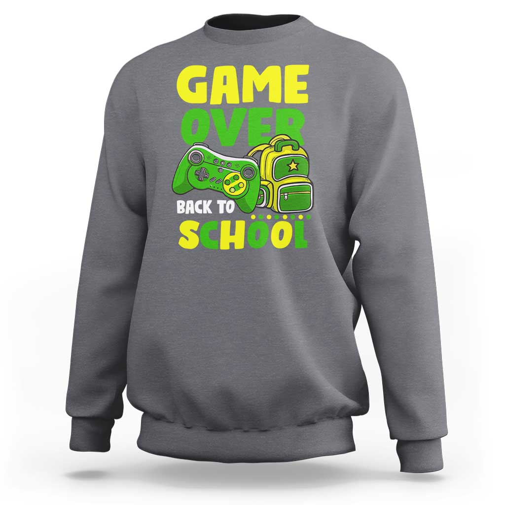Light gray crewneck sweatshirt with “GAME OVER” and game-themed “BACK TO SCHOOL” graphic