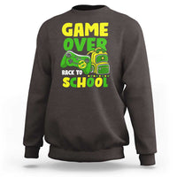 Charcoal gray crewneck sweatshirt with “GAME OVER” and game-themed “BACK TO SCHOOL” graphic