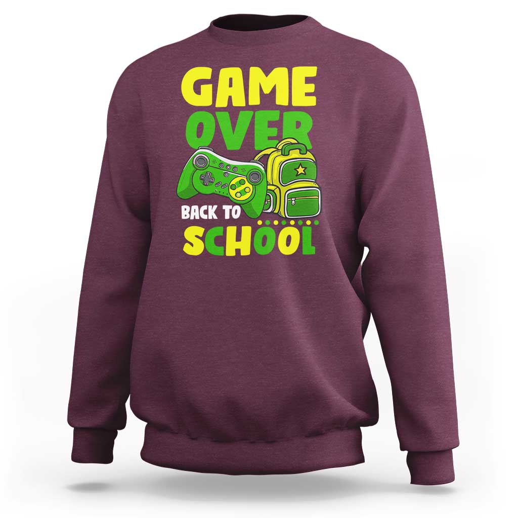Maroon crewneck sweatshirt with “GAME OVER” and game-themed “BACK TO SCHOOL” graphic