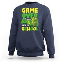 Navy crewneck sweatshirt with “GAME OVER” and game-themed “BACK TO SCHOOL” graphic