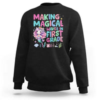 Black sweatshirt with mermaid graphic and “MAGICAL WAVES IN FIRST GRADE” text