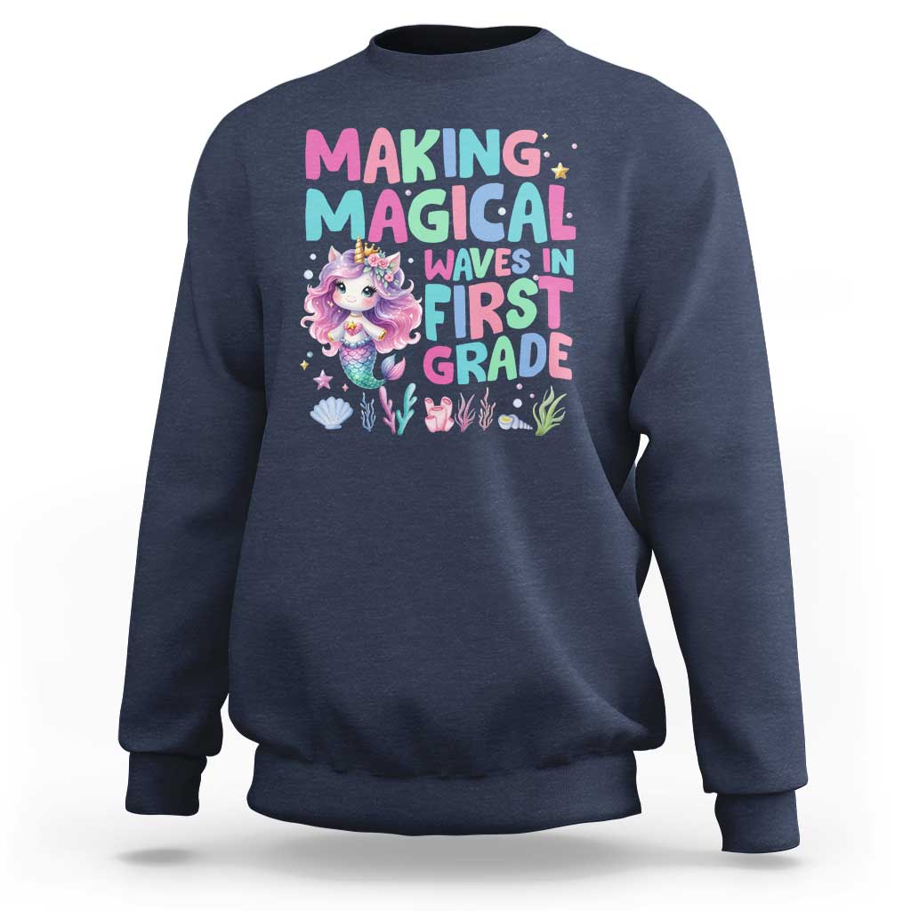 Navy sweatshirt with mermaid graphic and “MAGICAL WAVES IN FIRST GRADE” text