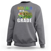Charcoal kids sweatshirt with "Rolling Into 3rd Grade" roller skates front graphic