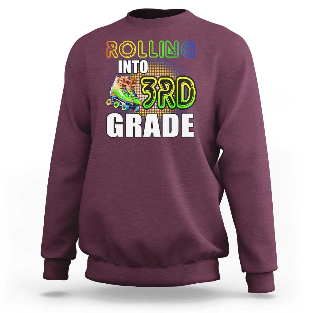 Maroon kids sweatshirt with "Rolling Into 3rd Grade" roller skates front graphic