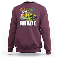 Maroon kids sweatshirt with "Rolling Into 3rd Grade" roller skates front graphic
