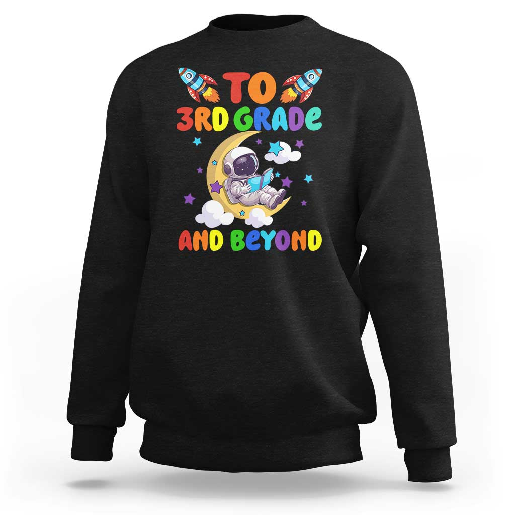 Black sweatshirt with astronaut graphic and “To 3rd Grade and Beyond” text