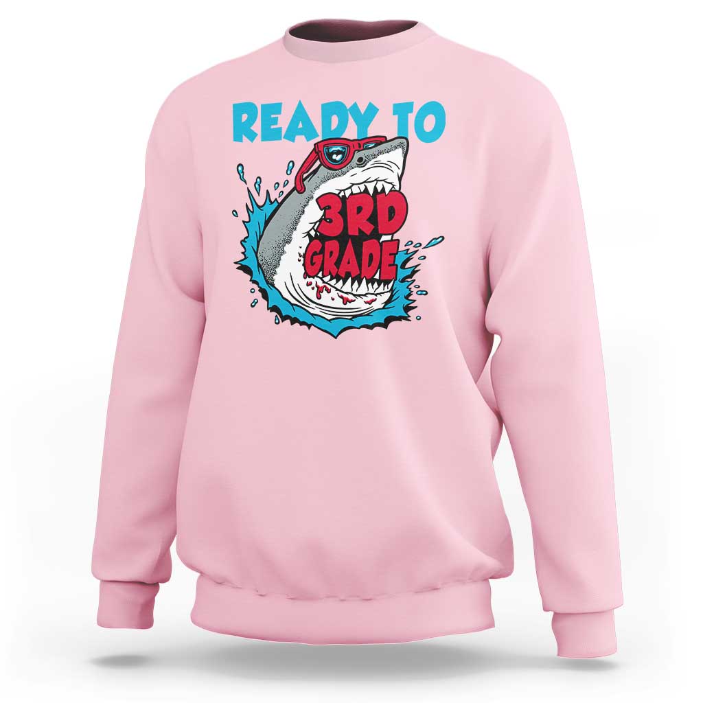 Light pink sweatshirt with teal “Ready to 3rd Grade” shark graphic on the front