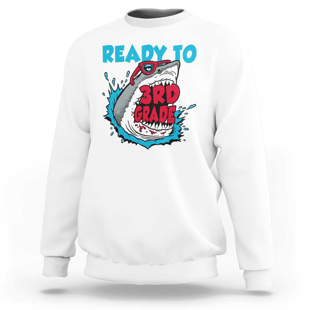 White sweatshirt with teal “Ready to 3rd Grade” shark graphic on the front