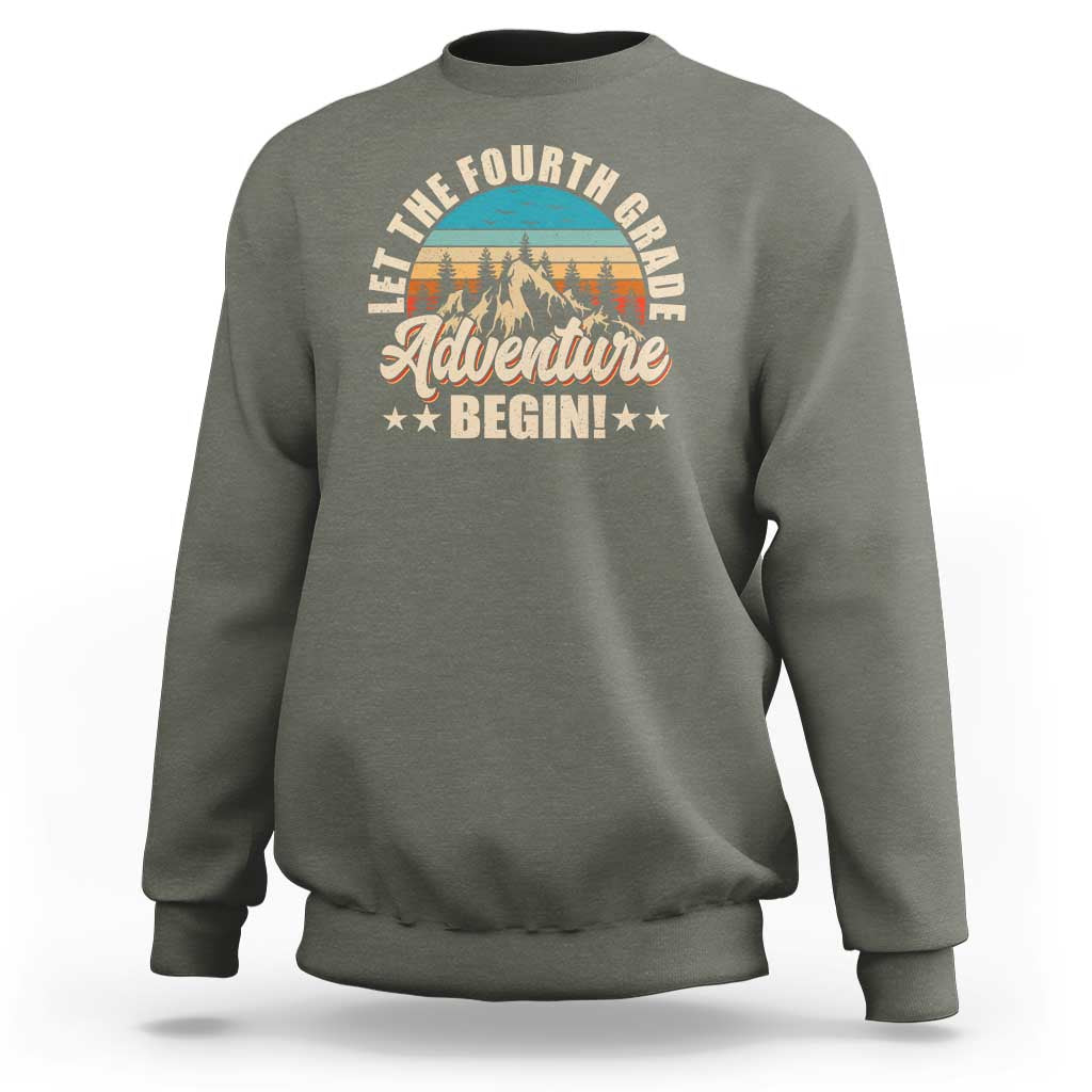 Dark gray crewneck sweatshirt with front “Adventure Begin” graphic and animal illustration.