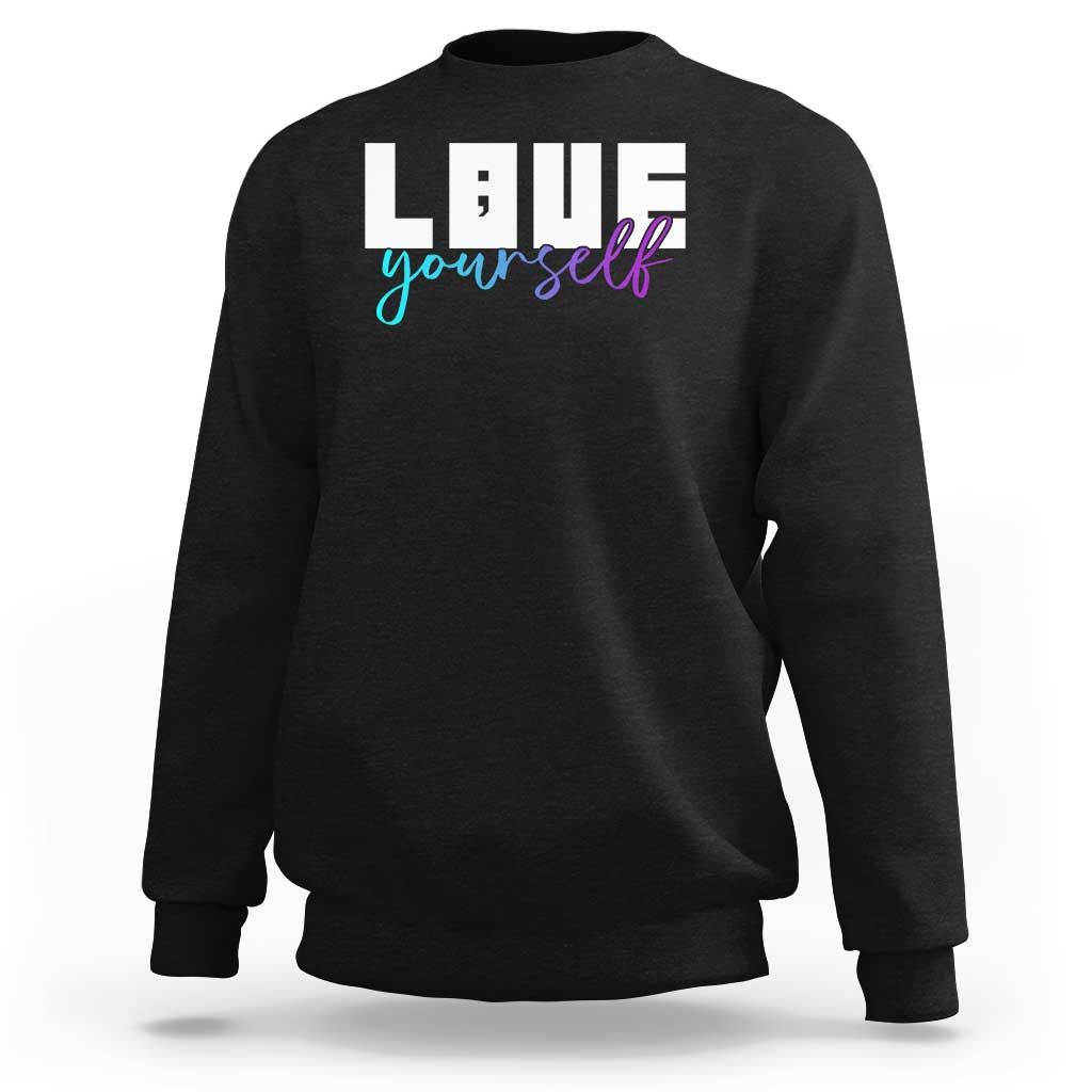 Black sweatshirt with “Love yourself” graphic and semicolon on front