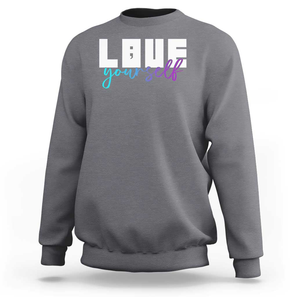 Charcoal gray sweatshirt with “Love yourself” graphic and semicolon on front
