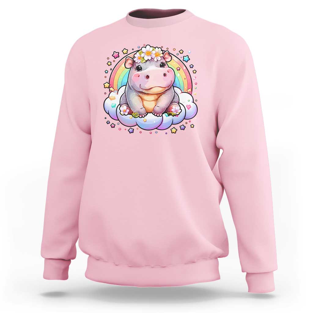 Light pink baby hippo sweatshirt with pastel rainbow and flower graphic on front