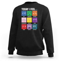 Black sweatshirt with colorful emotion face grid graphic and “Today I Feel...” text