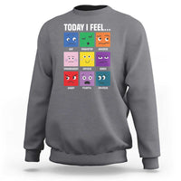 Charcoal gray sweatshirt with colorful emotion face grid graphic and “Today I Feel...” text