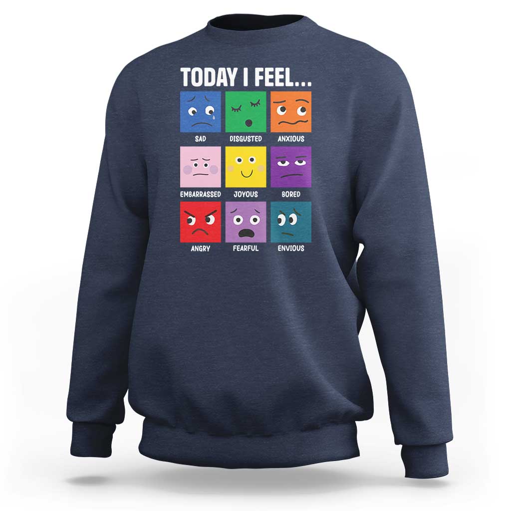Navy sweatshirt with colorful emotion face grid graphic and “Today I Feel...” text