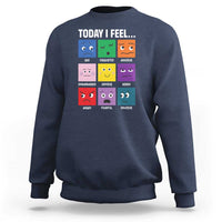 Navy sweatshirt with colorful emotion face grid graphic and “Today I Feel...” text