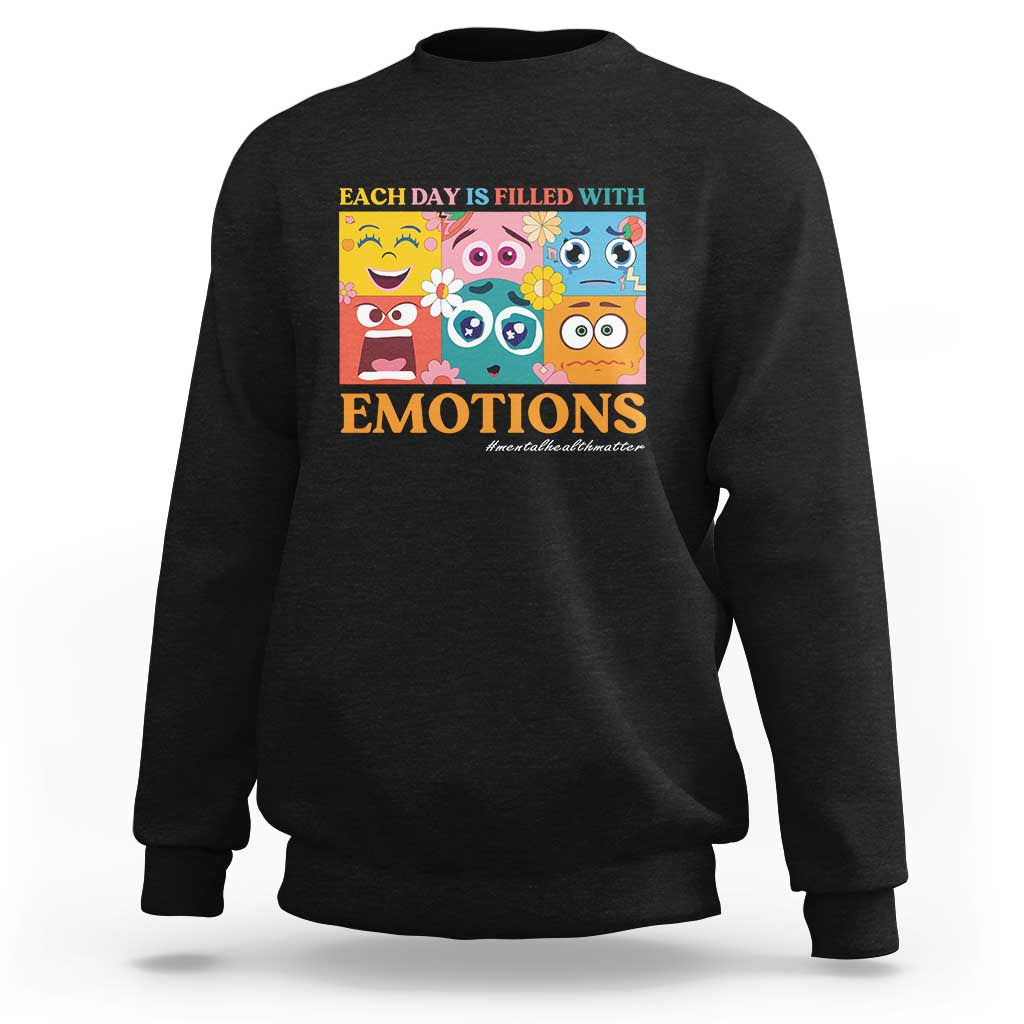 Black emotions sweatshirt with colorful face-themed graphic on chest