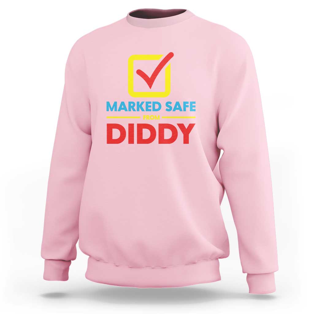 Light pink sweatshirt with “Marked Safe from Diddy” front graphic