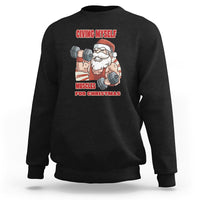 Black crewneck sweatshirt with Santa weightlifter graphic and “Muscles for Christmas” text