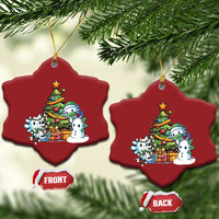 Pair of red heart axolotl Christmas ornaments with tree scene, gold hanging loops