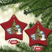 Pair of red star axolotl Christmas ornaments with tree scene, front and back tags