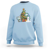 Light blue Christmas axolotl sweatshirt with cartoon tree graphic on the chest