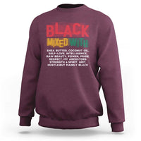 Maroon crewneck sweatshirt with “BLACK MIXED WITH” printed graphic on chest