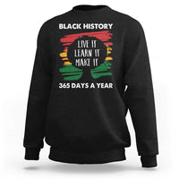 Black crewneck sweatshirt with “Black History” graphic and “Live It Faran It Make It” text