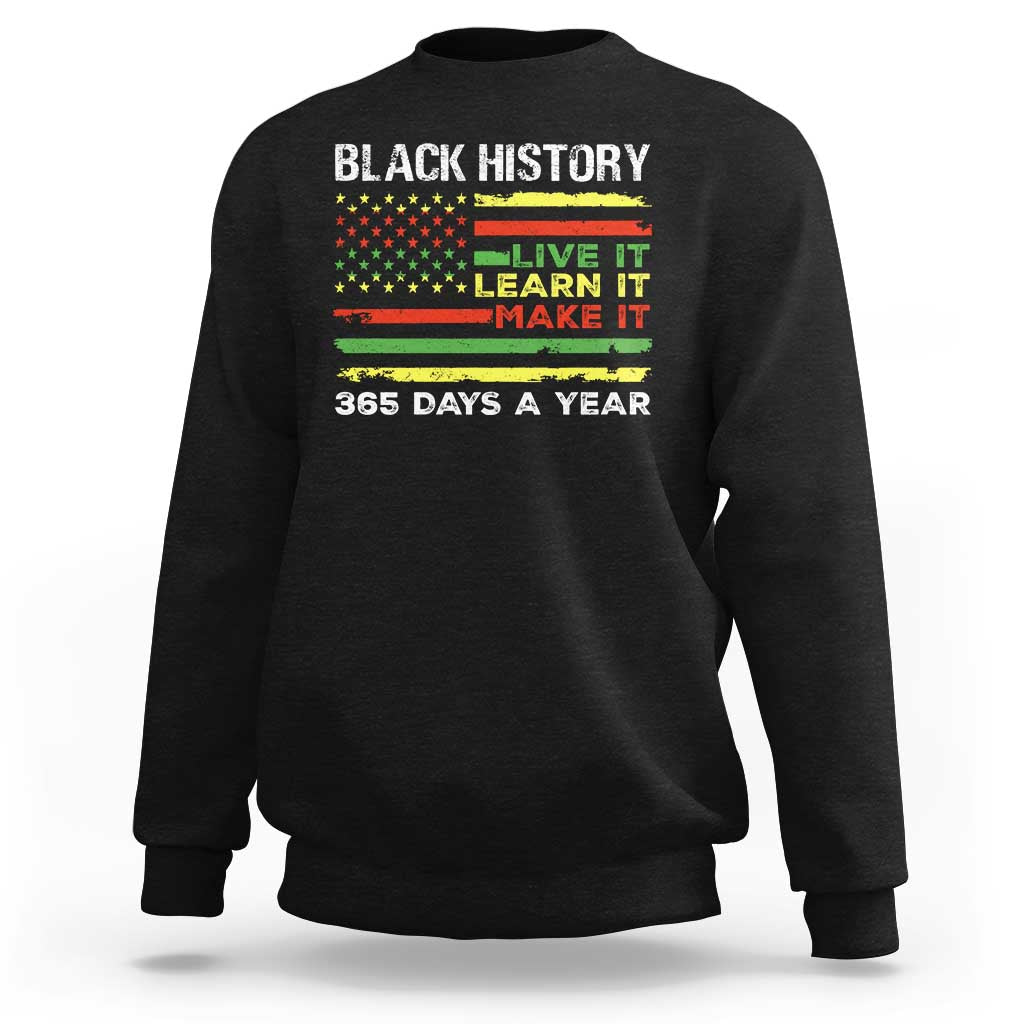 Black crewneck sweatshirt with 'BLACK HISTORY' text and 'LIVE IT LEARN IT MAKE IT' print.