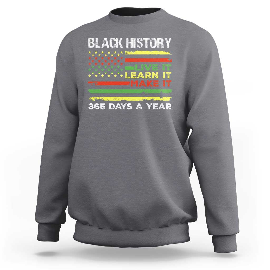 Charcoal crewneck sweatshirt with 'BLACK HISTORY' text and 'LIVE IT LEARN IT MAKE IT' print.