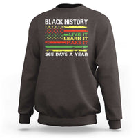 Dark chocolate crewneck sweatshirt with 'BLACK HISTORY' text and 'LIVE IT LEARN IT MAKE IT' print.