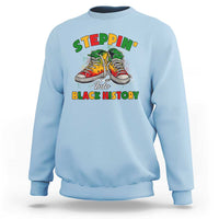 Light blue crewneck sweatshirt with colorful 'Steppin' Into Black History' graphic
