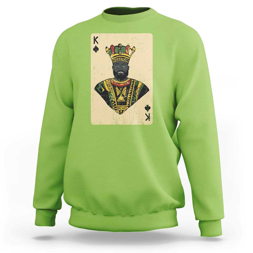 Lime green crewneck sweatshirt with front playing-card king graphic, long sleeves