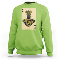 Lime green crewneck sweatshirt with front playing-card king graphic, long sleeves
