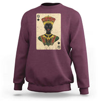 Maroon crewneck sweatshirt with queen card graphic and crown on chest