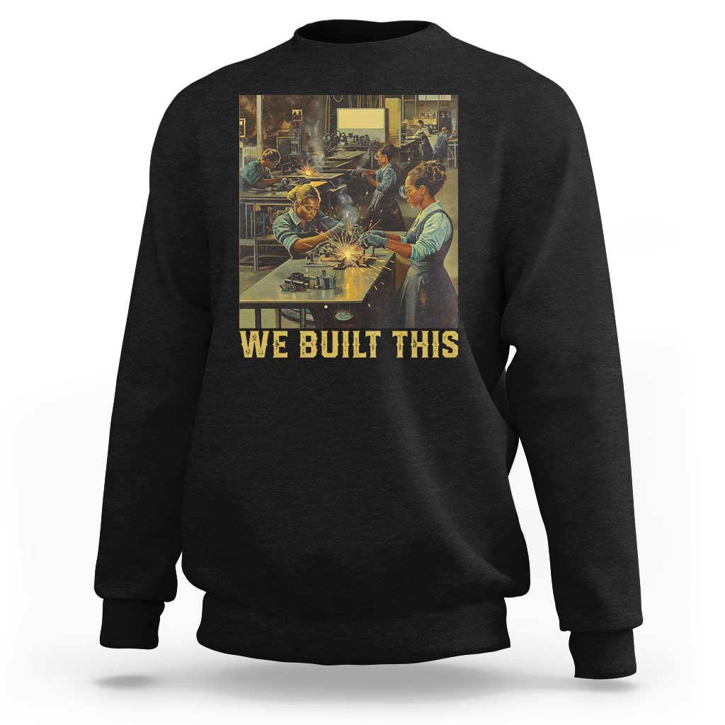 Black crewneck sweatshirt with 'WE BUILT THIS' graphic on front