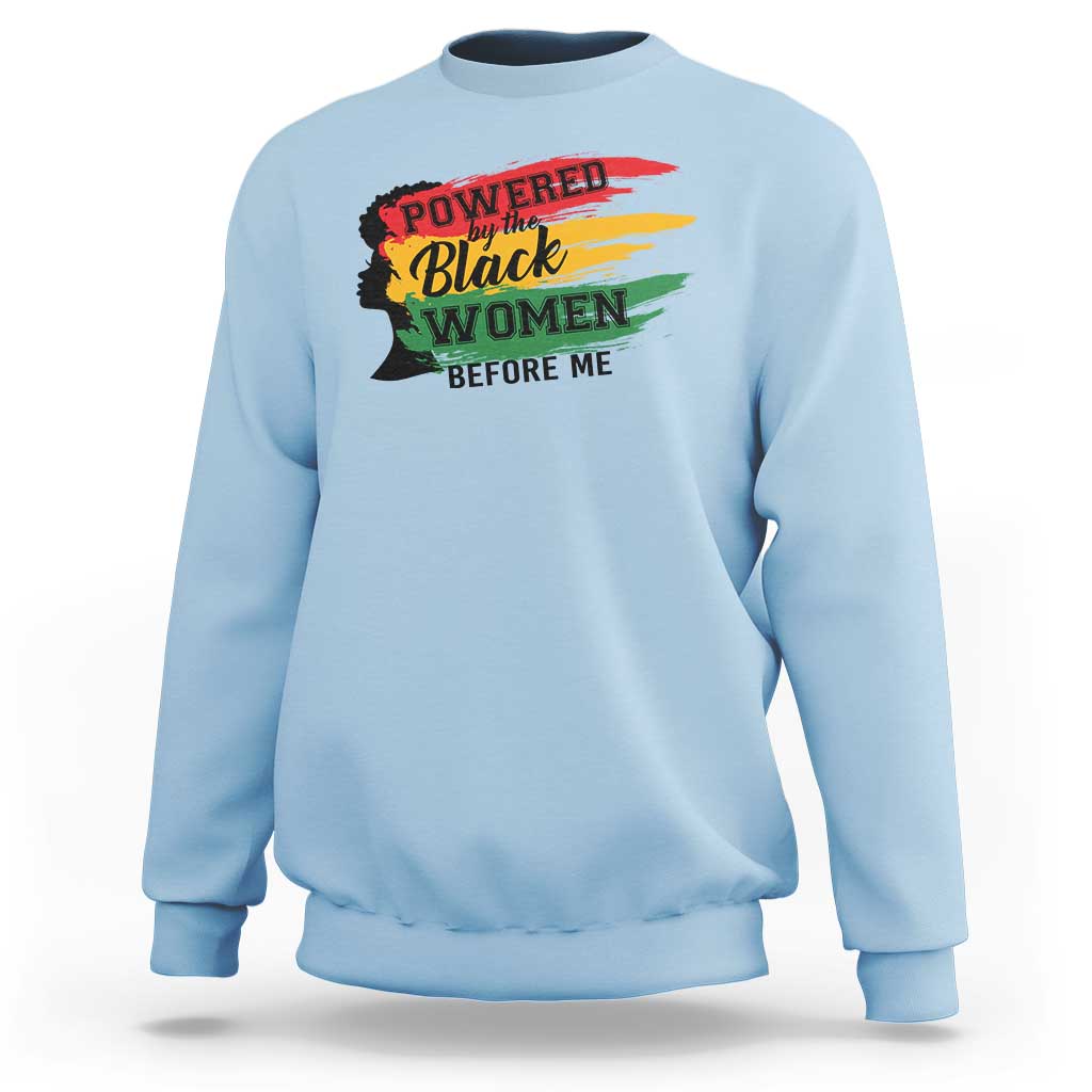 Light blue crewneck sweatshirt with colorful 'Powered by the Black Women Before Me' graphic