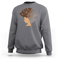 Charcoal gray women's crewneck sweatshirt with back face-silhouette and typographic graphic