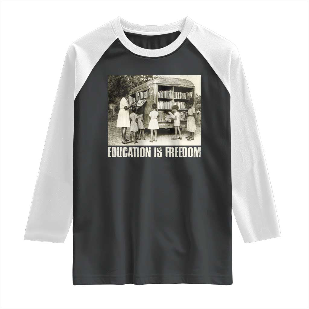Black-and-white raglan shirt with 'Education is Freedom' front graphic