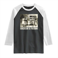 Black-and-white raglan shirt with 'Education is Freedom' front graphic